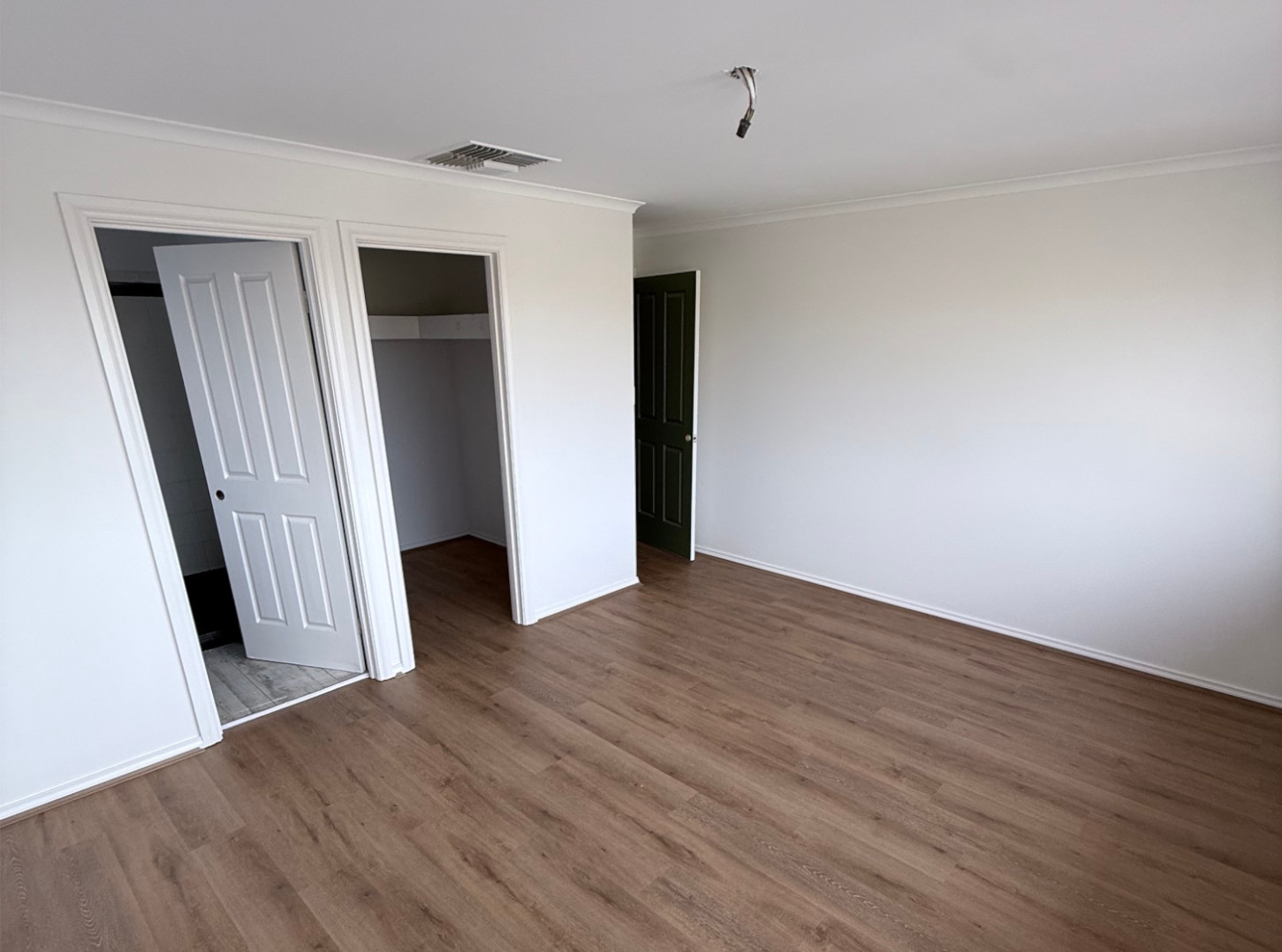 After: hybrid flooring installed in bedroom