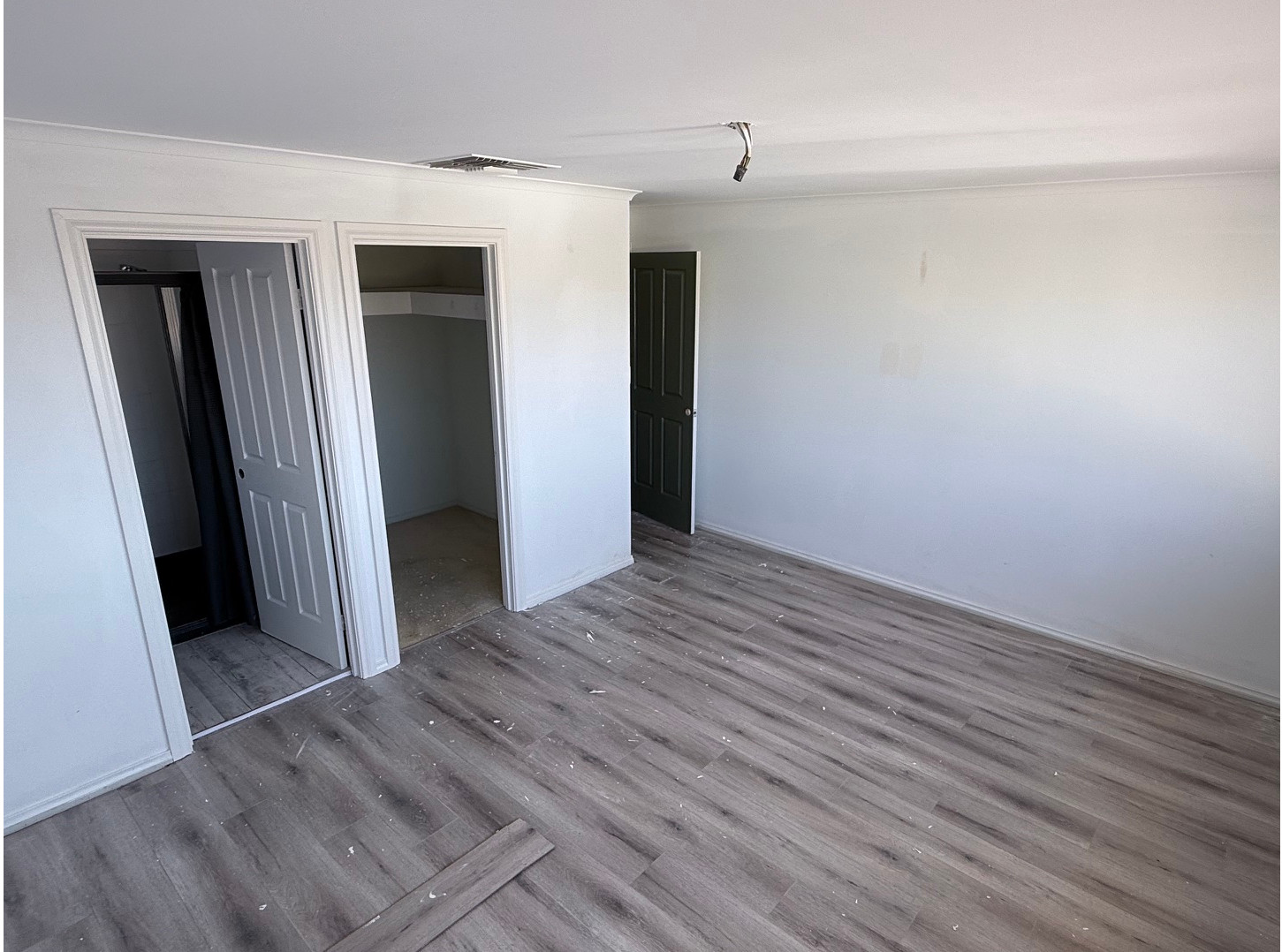 Before: original flooring in bedroom